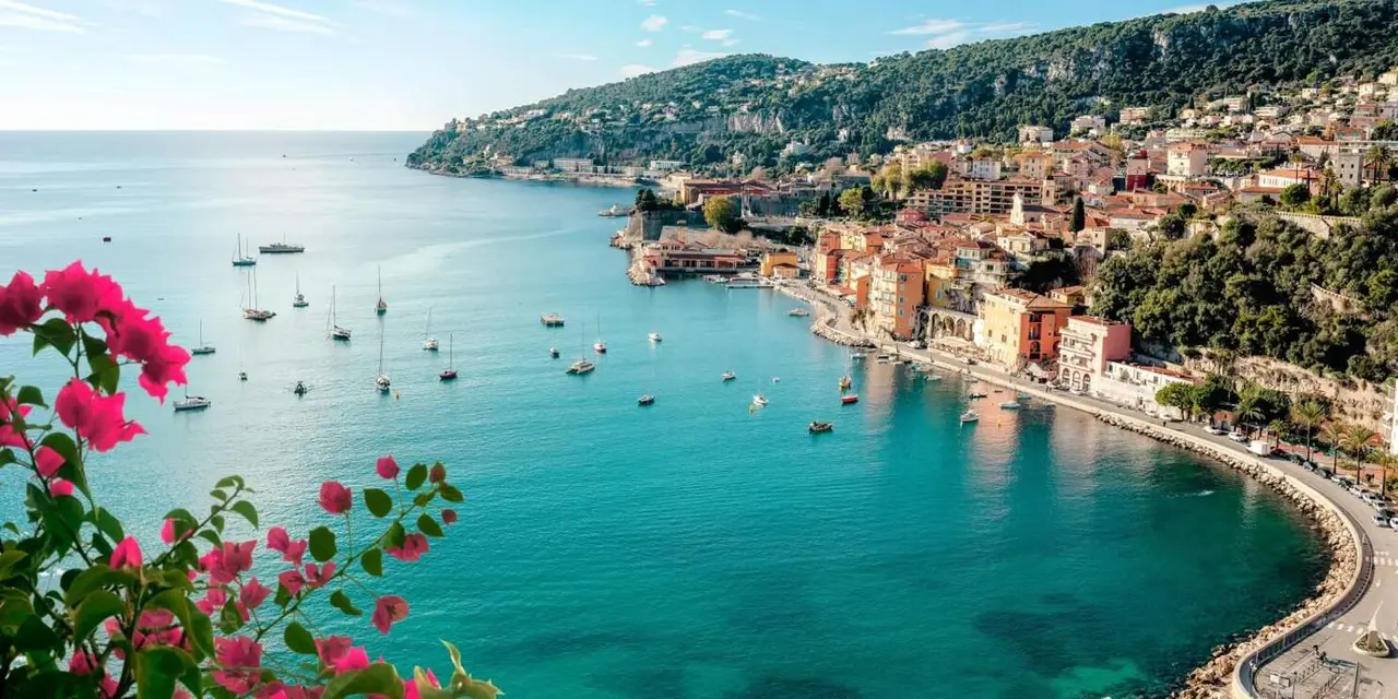 Aerial view of the Villefranche bay with yachts at anchor and the village along the shore