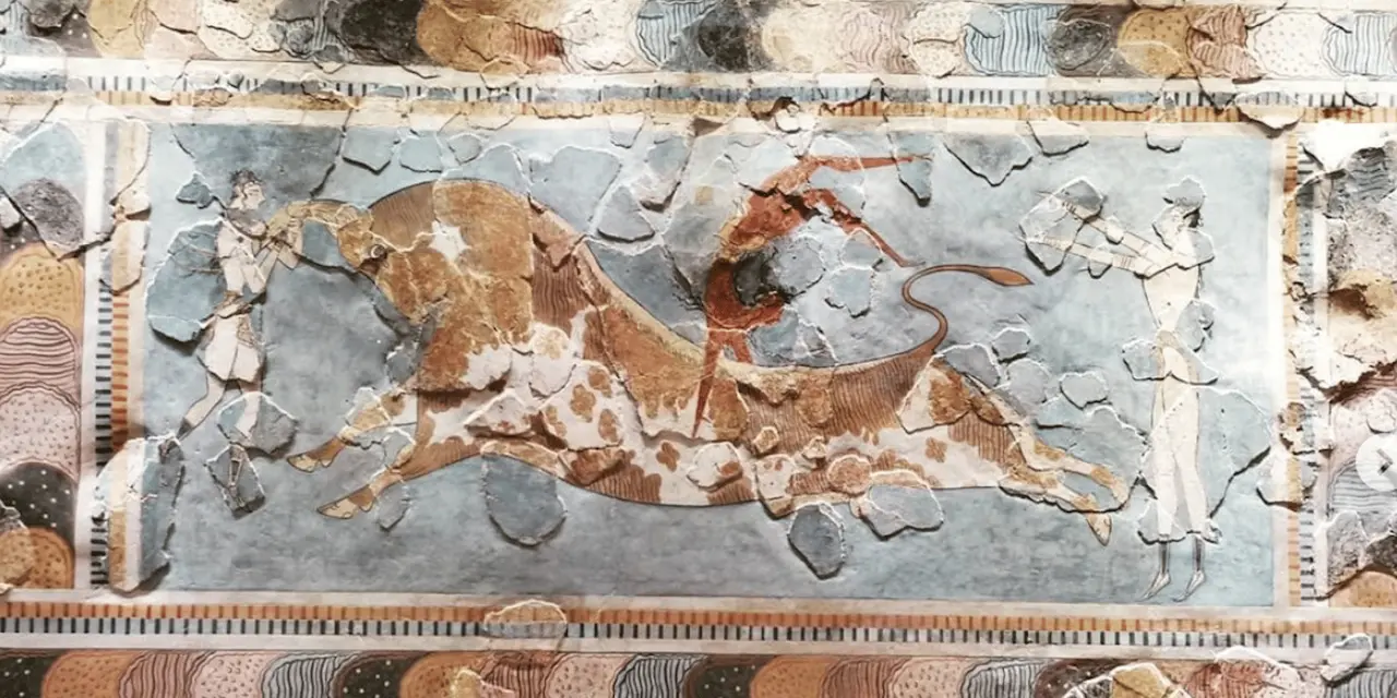 A Minoan fresco fragment showing a charging bull on pale plaster