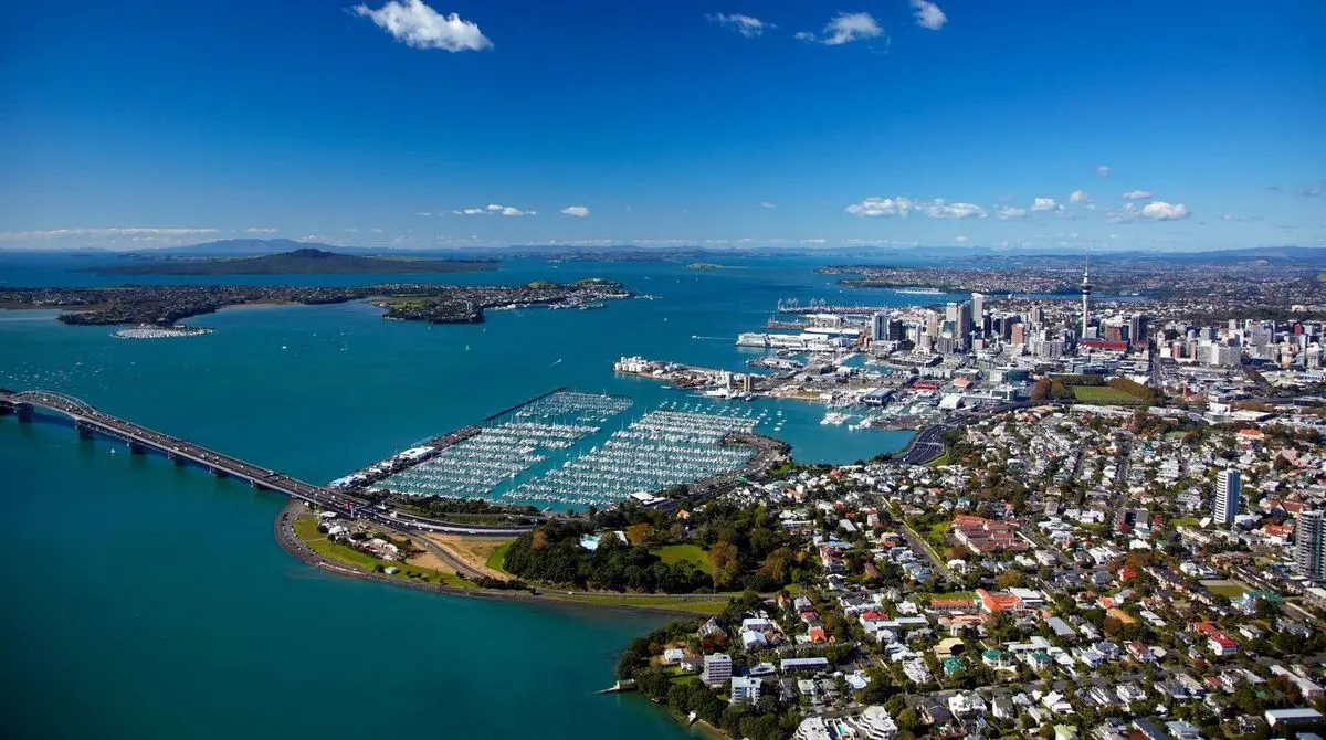 Aerial view of the Auckland Harbour Bridge, the Westhaven marina and the city skyline across the water
