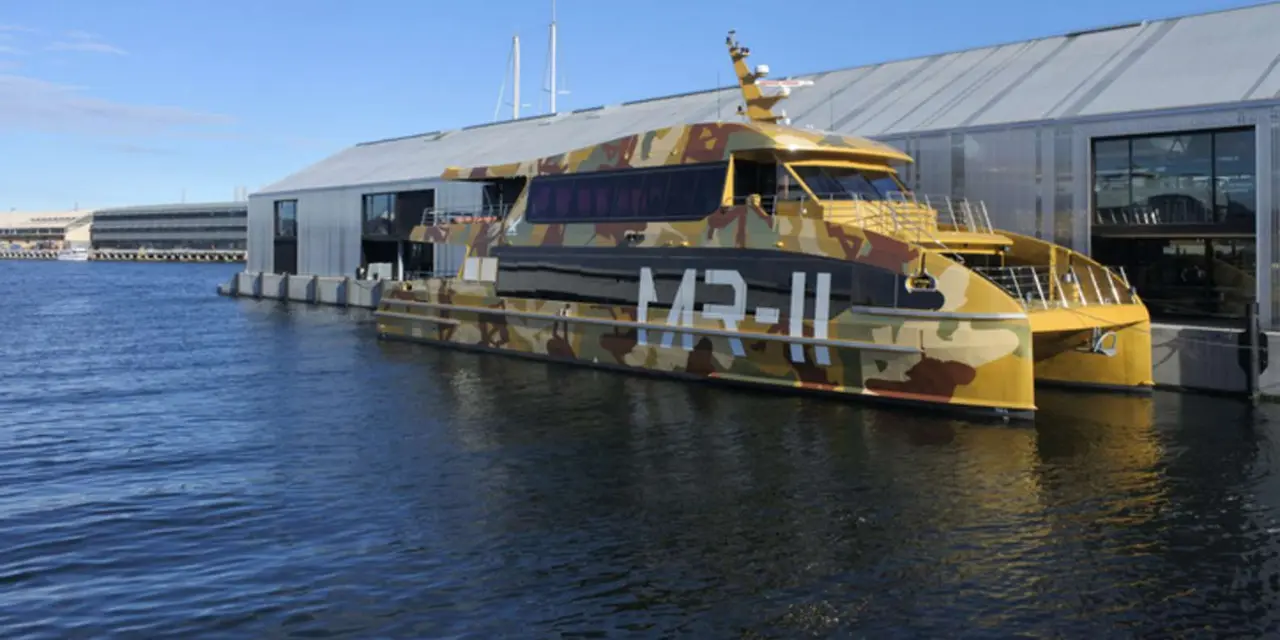The MONA ferry moored beside the museum's riverside building