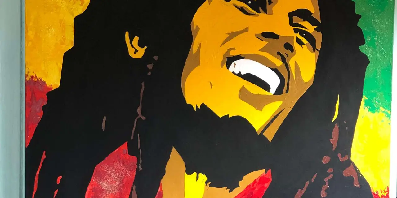 A red, yellow and green painted portrait of Bob Marley