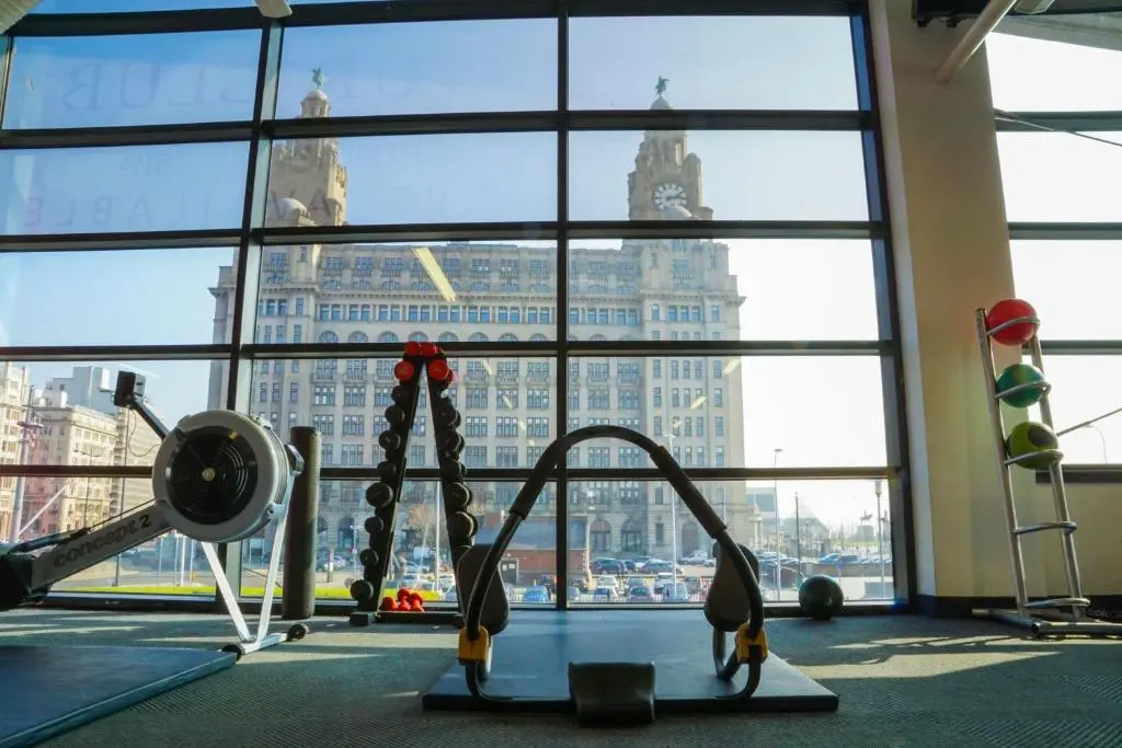 The Crowne Plaza Liverpool City Centre gym, its floor-to-ceiling windows looking straight out at the Royal Liver Building