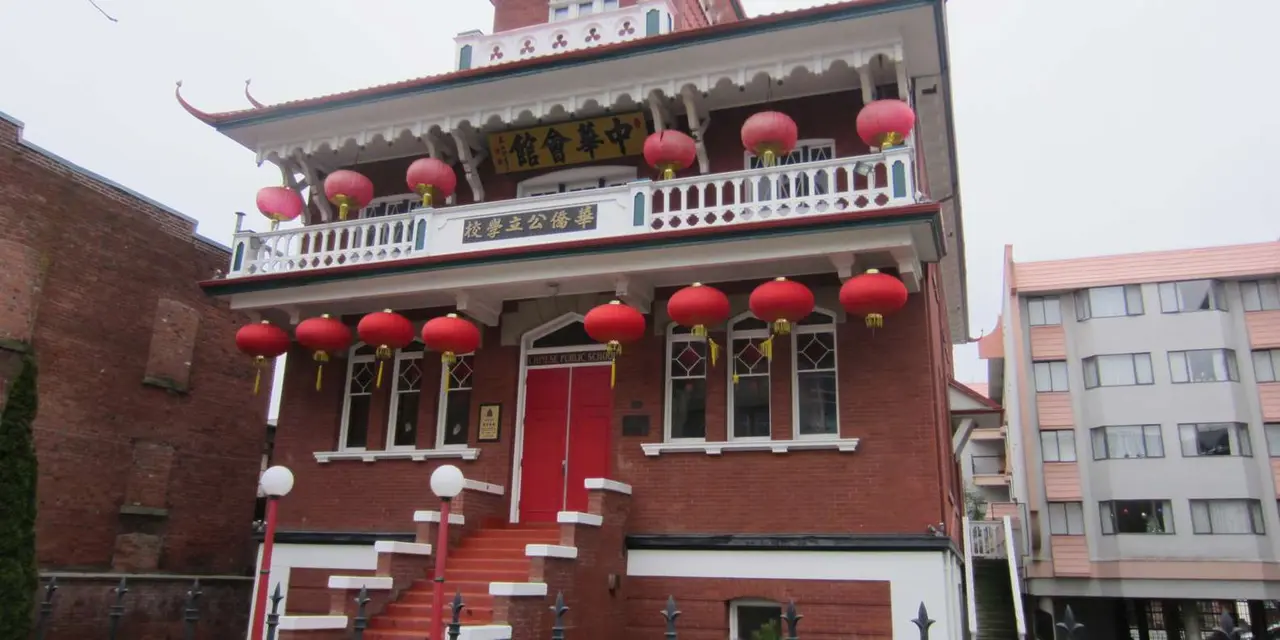 The red-and-white Chinese Public School building in Victoria's Chinatown, hung with red lanterns