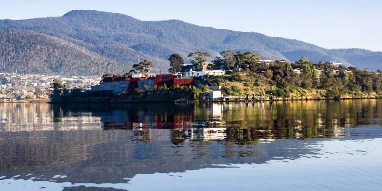 Hobart's waterfront and wooded hills under a blue sky