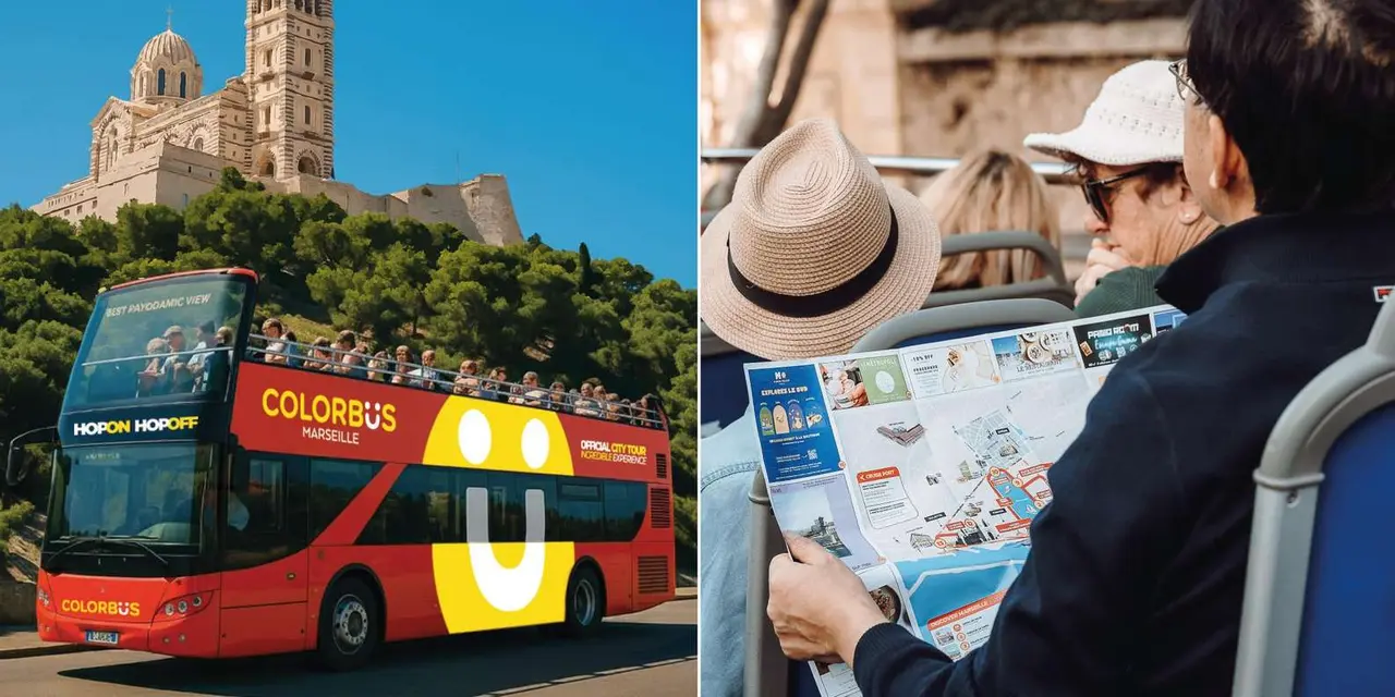 Riders on an open-top bus looking at a map, with a red sightseeing bus and a hilltop fort behind