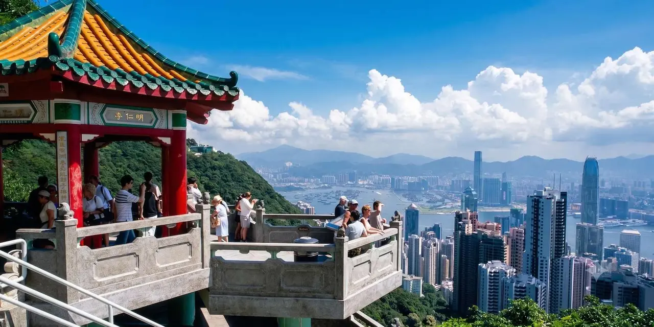 A red-roofed Chinese lookout pavilion with visitors