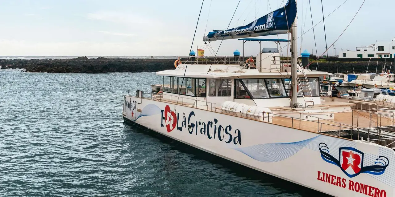 A white catamaran marked La Graciosa tied up in a harbour