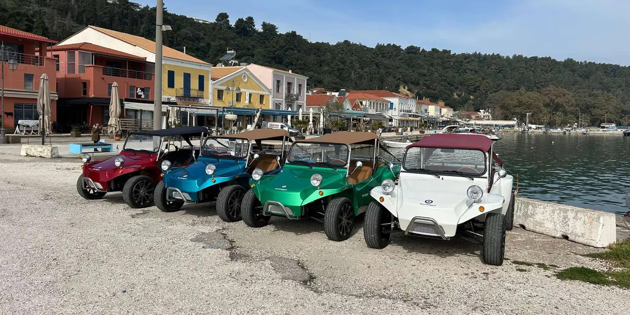 A row of colourful open-top beach buggies parked on Katakolon's waterfront